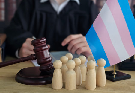 Courtroom scene featuring transgender rights advocates and a gavel on the judge's benchの写真素材