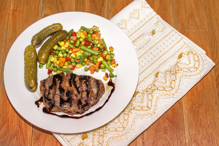 appetizing grilled meat with grilled vegetables for dinnerの写真素材