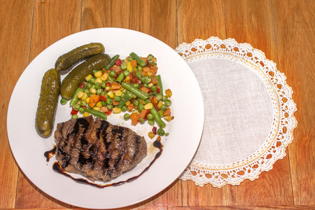 appetizing grilled meat with grilled vegetables for dinnerの写真素材