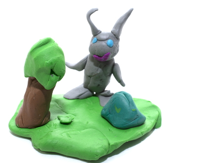 grey bunny in the meadow of plasticineの写真素材