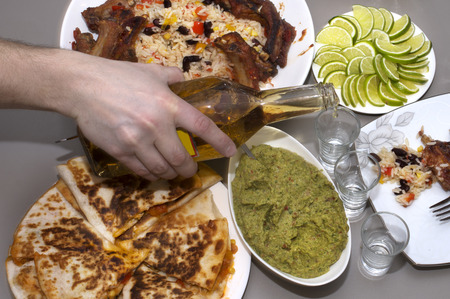Mexican party. tequila and traditional Mexican dishes on the tableの写真素材