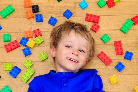 child playing with colorful plastic blocks indoor, early learningの写真素材
