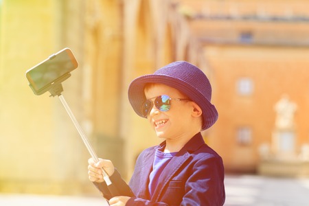 smart happy little boy taking selfie stick picture while travel in Europe, Maltaの写真素材