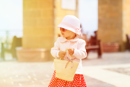 cute little lady travelling in the city of Europe,の写真素材