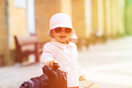 cute little lady travelling in the city of Europeの写真素材
