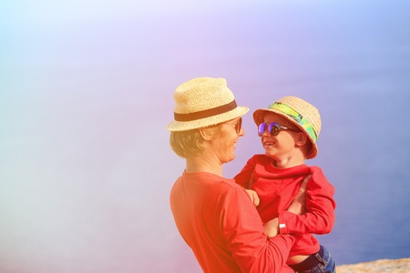 happy father and son playin on summer skyの写真素材