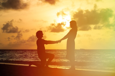 Marriage Proposal at sunset idyllic tropical beachの写真素材