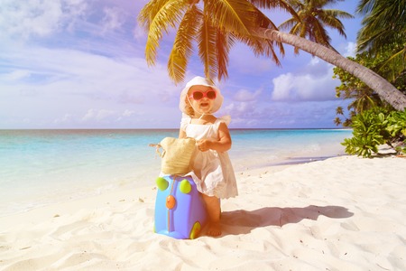 cute little girl travel on summer beach, kids travelの写真素材