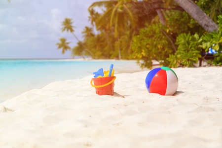 kids toys on tropical sand beach, family vacationの写真素材
