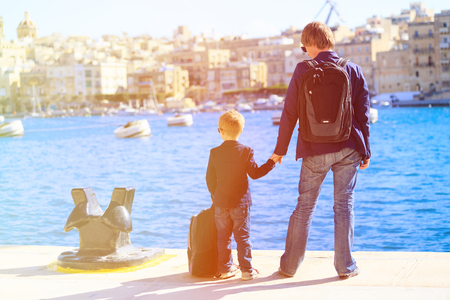 father and son looking at city of Valetta, Malta, family travelの写真素材