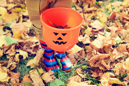 little boy with rubber boots at fall, kids autumn activitiesの写真素材