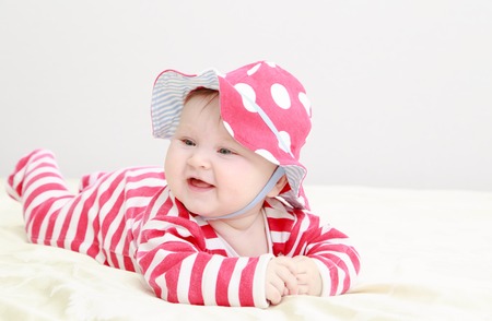 cute baby girl portrait in red hat