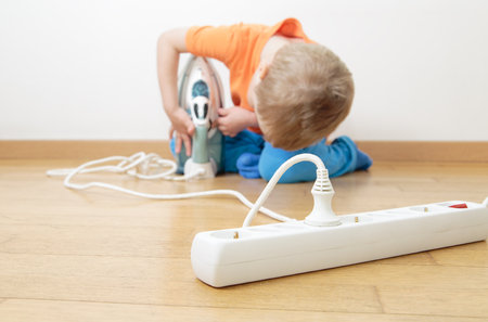 child playing with electricity, kids safety conceptの写真素材