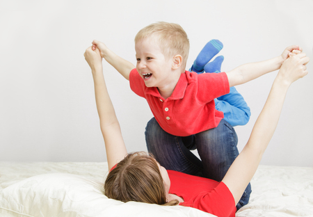 mother and son playing at home, family lifestyleの写真素材