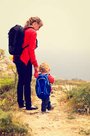 mother and little daughter travel in mountains on summerの写真素材