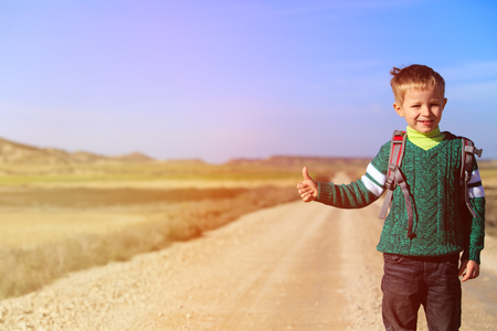 little boy with backpack loves travel on the road, kids travelの写真素材