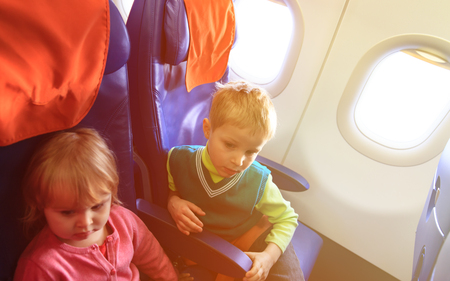 little boy and girl travel by plane, kids travelの写真素材