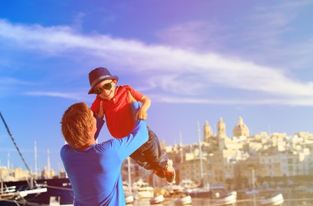 father and son playing on the quay of Valetta, Malta, family travelの写真素材