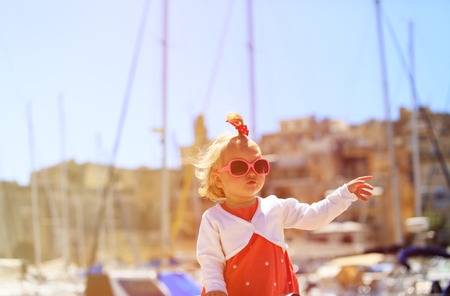 cute little girl travel in the port, kids travelの写真素材