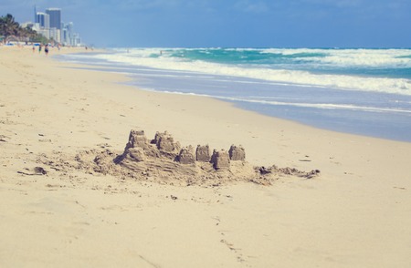 Sand castle on the beach, family vacation