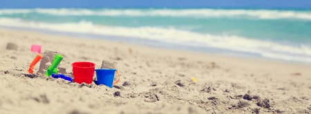 kids play on beach concept- toys in sandの写真素材