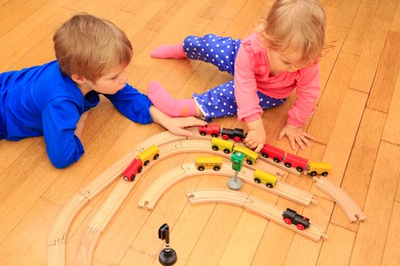 learning and daycare -kids playing with railroad and trains indoor,の写真素材