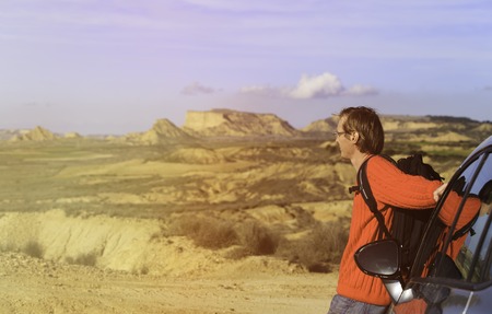 young man travel by car in mountains, travel conceptの写真素材