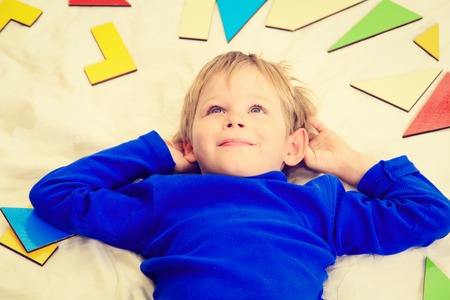 happy little boy with puzzle toys, early learning conceptの写真素材
