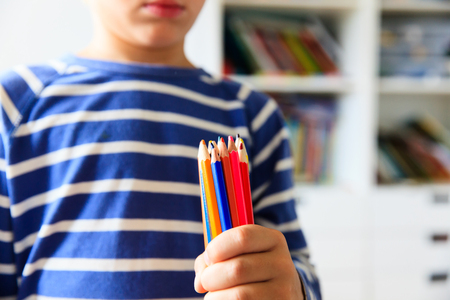 little boy holding pencils, back to school conceptの写真素材