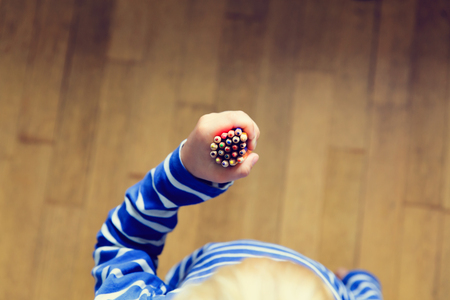 child hand with pencils, education and learning conceptの写真素材