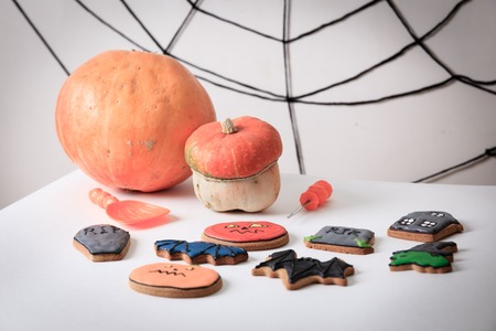 Halloween homemade gingerbread cookies and pumpkin ready for partyの写真素材