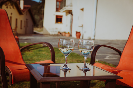 two glasses of wine in countryside, relax out of town conceptの写真素材