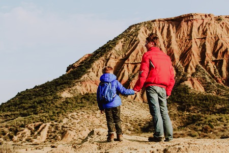father and son travel in scenic mountains, family travel