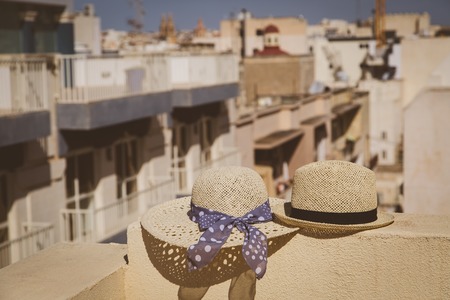 two hats on vacation in urban Europe, luxury vacation conceptの写真素材