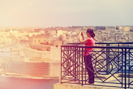 young tourist making photo of Valetta, Malta, travel conceptの写真素材