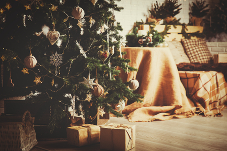 Christmas tree and presents in decorated living room, Christmas and New Year conceptの写真素材