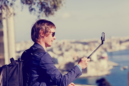 travel concept- tourist taking a selfie photo while travel in Europeの写真素材