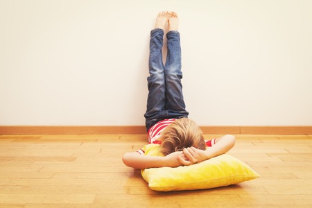 little boy relax at home, home laziness and comfortの写真素材