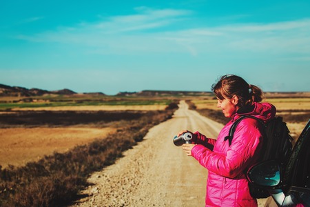 young woman travel by car on scenic road in winter, travel and tourism