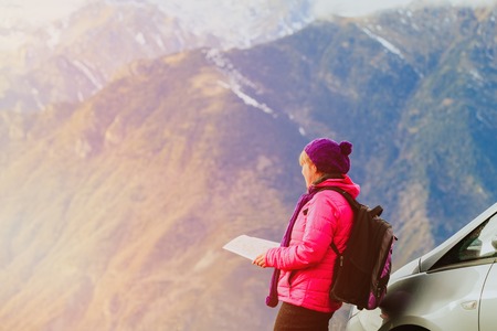 young woman travel in scenic winter mountainsの写真素材