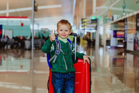 little boy loves travel in the airport, family travelの写真素材