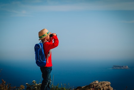 little boy hiking in mountains, family travel conceptの写真素材