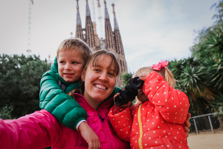 Family tourism - mother with kids travel in Barcelona, Spainの写真素材