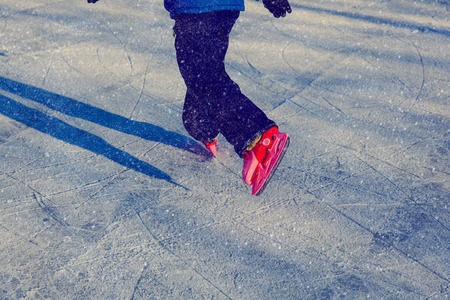 little boy skating in winter snow nature, winter sportの写真素材
