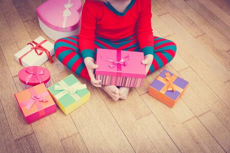 child taking christmas presents, family Christmas celebrationの写真素材
