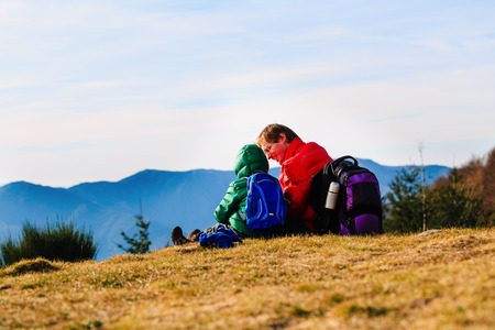 family travel-father and little son hiking in mountainsの写真素材