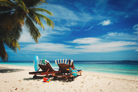 Two chairs on the tropical beach, family at beachの写真素材