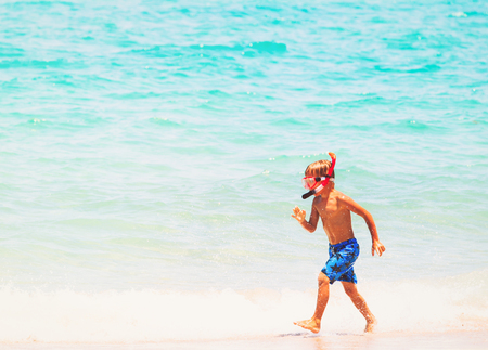 little boy go dive at summer beachの写真素材