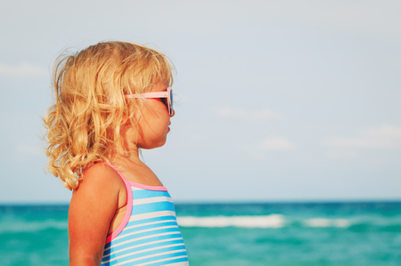 cute little girl at summer beachの写真素材