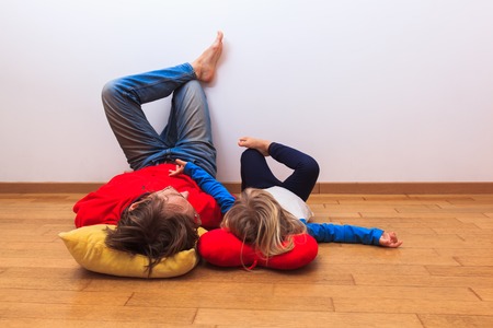 Dad and daughter relax at homeの写真素材